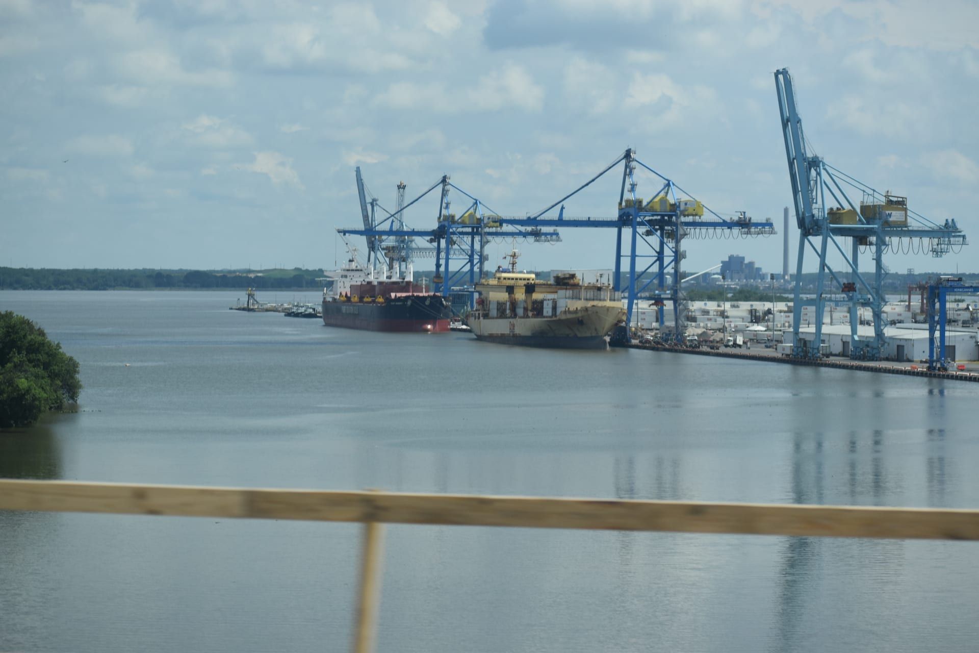Industrial port with cargo ships and cranes