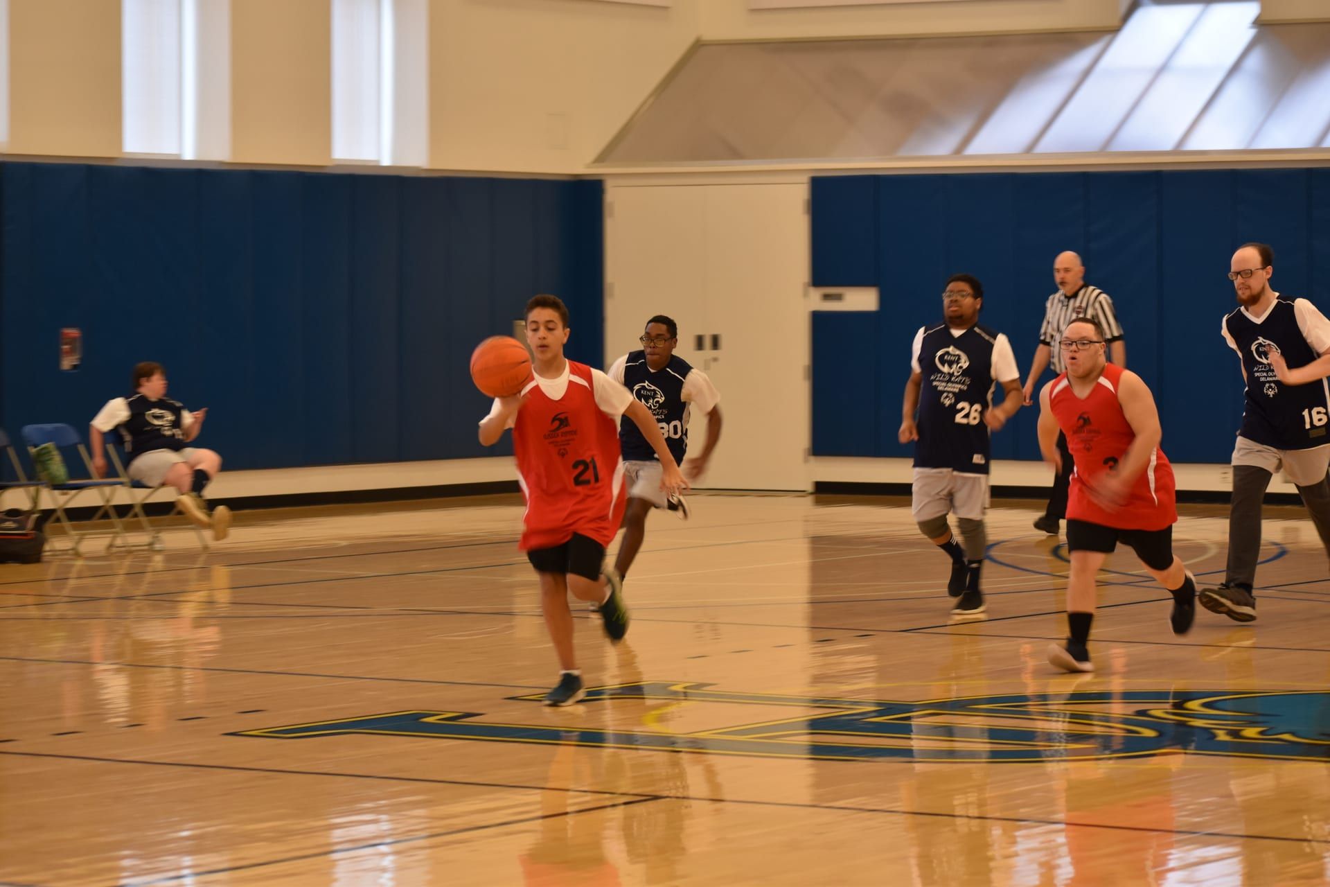 Basketball player driving to basket